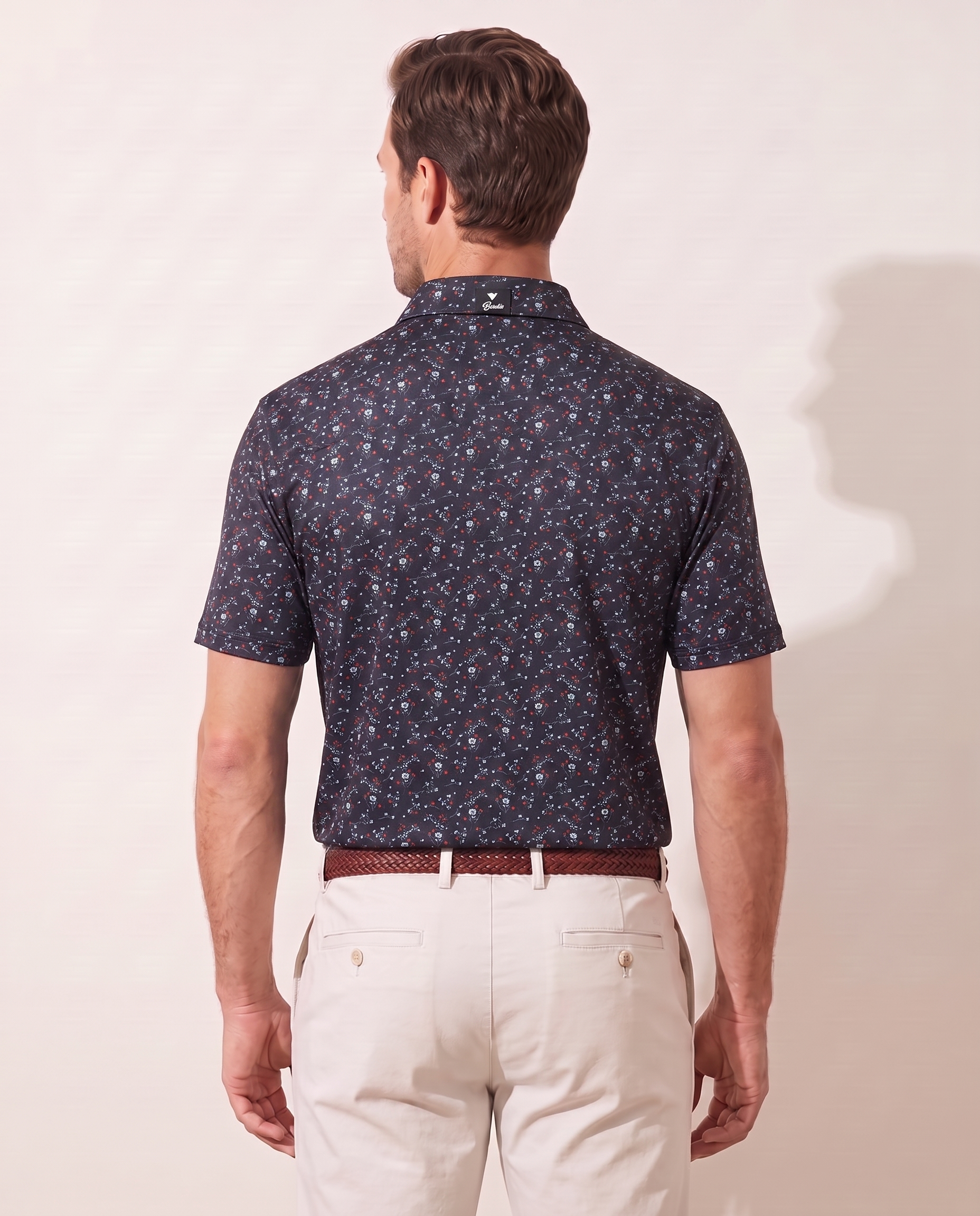 Revolution Rose polo on model — back view